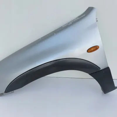 Mazda Tribute PRZEDNI BŁOTNIK LEWY PRZÓD 26A