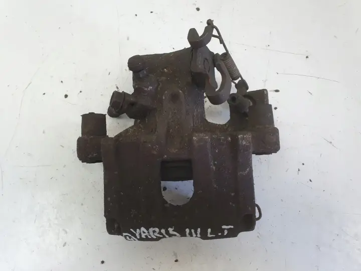 Toyota Yaris III TYLNY ZACISK HAMULCOWY lewy tył Kierowcy