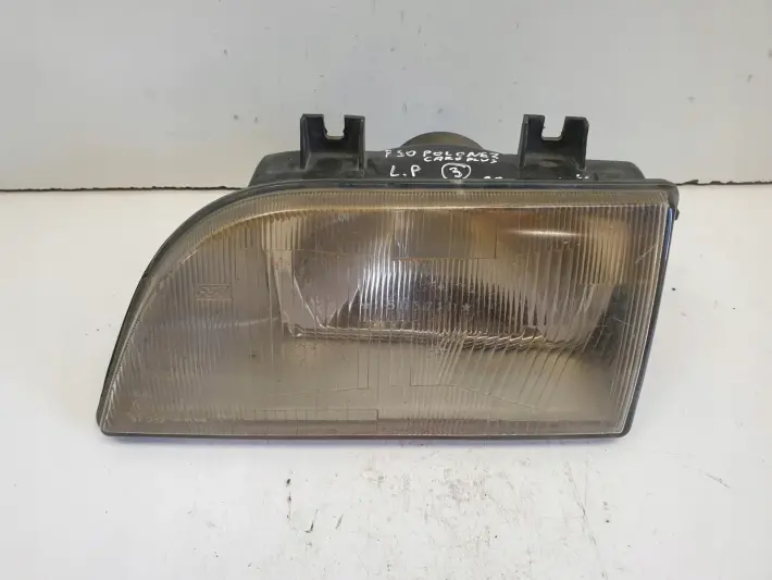 Polonez Caro Plus PRZEDNIA LAMPA LEWA lewy przód EUROPA