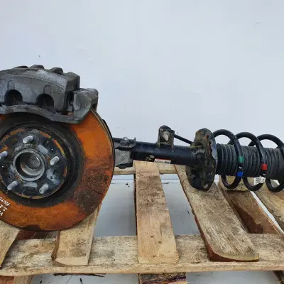 Santa Fe IV 2.2 CRDI LEWY AMORTYZATOR PIASTA Przód