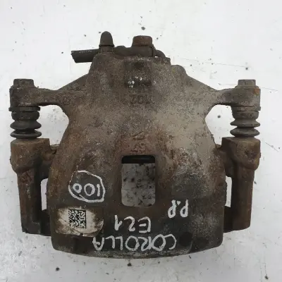 Toyota Corolla XII E21 PRAWY PRZEDNI ZACISK HAMULCOWY przód PASAŻERA