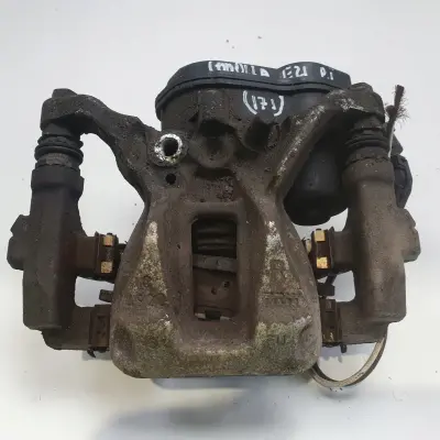 Toyota Corolla XII E21 TYLNY ZACISK HAMULCOWY prawy tył PASAŻERA A006B119B