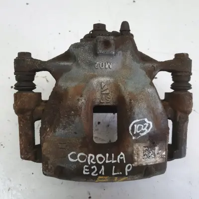 Toyota Corolla XII E21 PRAWY PRZEDNI ZACISK HAMULCOWY przód PASAŻERA