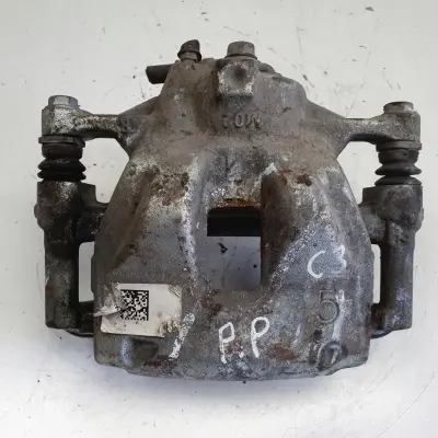 Toyota Corolla XII E21 PRZEDNI ZACISK HAMULCOWY prawy przód PASAŻERA P.P