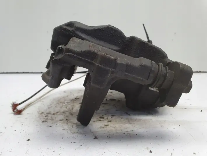 Toyota Corolla XII E21 TYLNY ZACISK HAMULCOWY lewy tył KIEROWCY