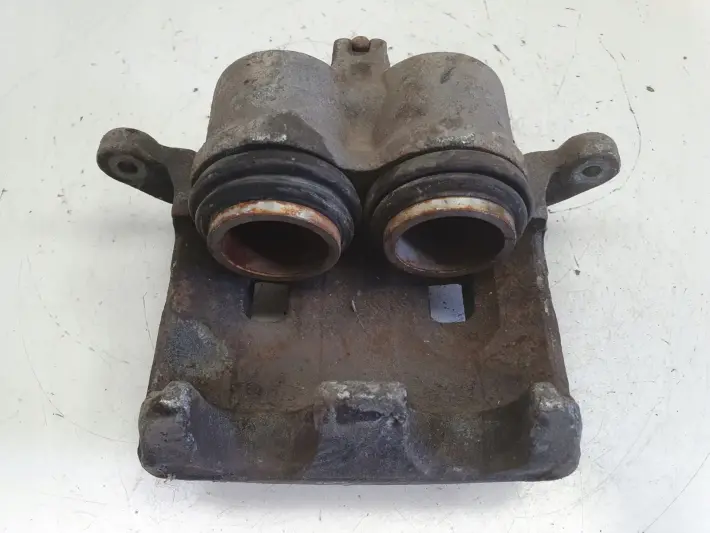 Nissan X-Trail T30 PRZEDNI ZACISK HAMULCOWY lewy przód KIEROWCY