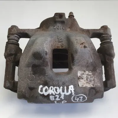 Toyota Corolla XII E21 PRZEDNI ZACISK HAMULCOWY lewy przód KIEROWCY L.P