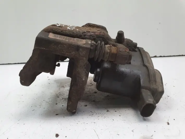 Audi Q5 TYLNY ZACISK HAMULCOWY lewy tył KIEROWCY 32347485B