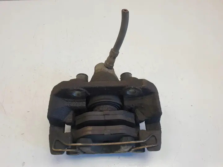 Saab 95 9-5 lift 2.0 T ZACISK HAMULCOWY Lewy tył