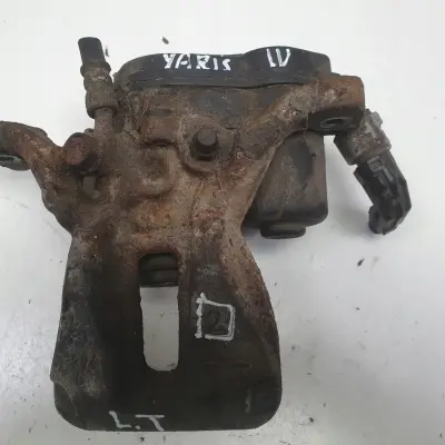 Toyota Yaris IV TYLNY ZACISK HAMULCOWY lewy tył KIEROWCY 46310-0D010