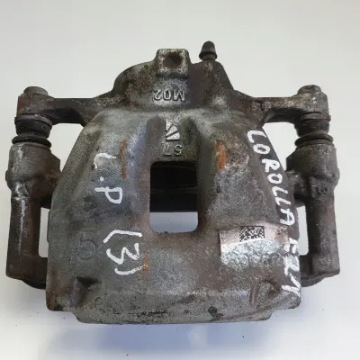 Toyota Corolla XII E21 PRZEDNI ZACISK HAMULCOWY lewy przód KIEROWCY L.P