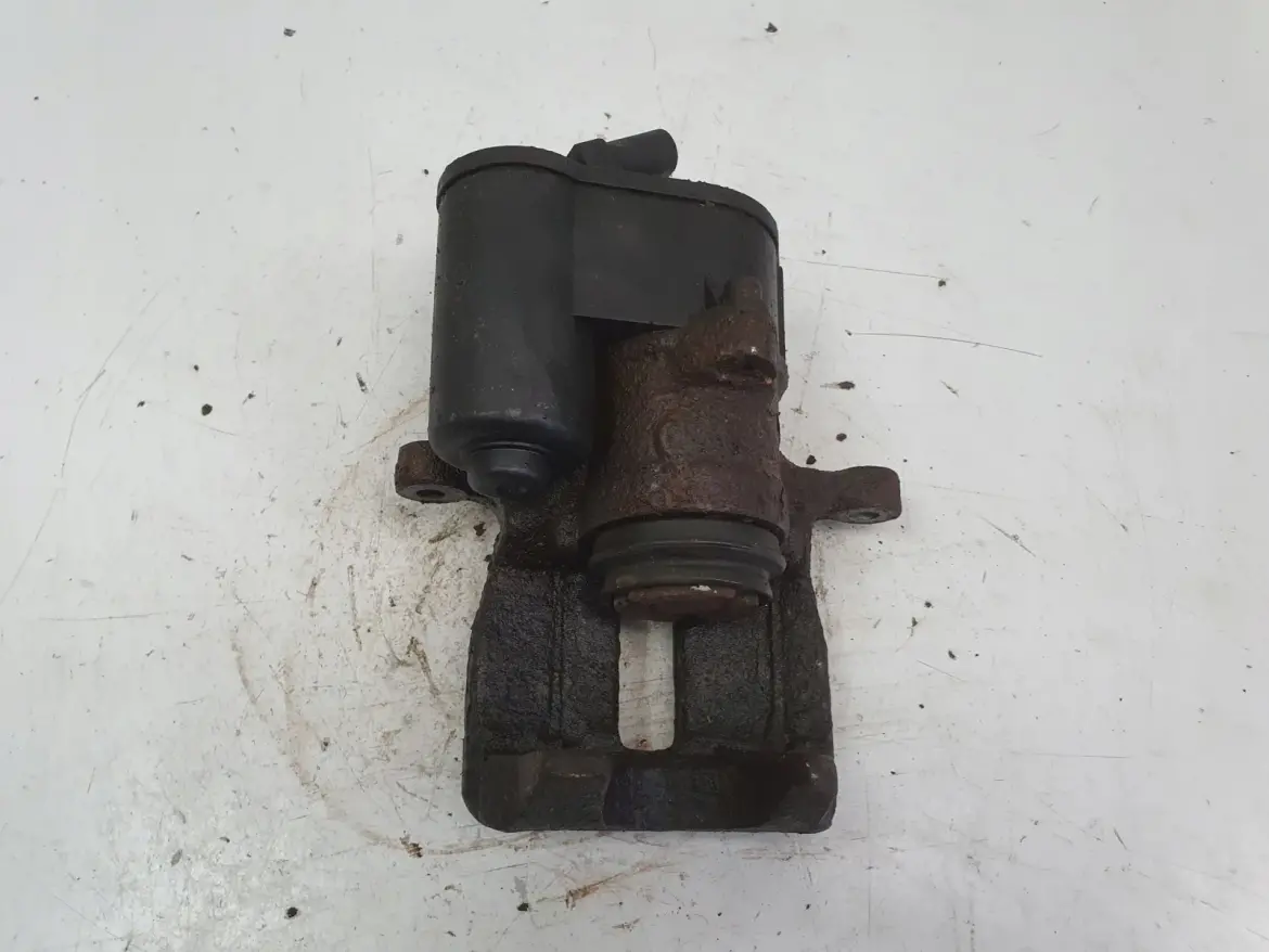 VW Passat B7 TYLNY ZACISK HAMULCOWY lewy tył KIEROWCY